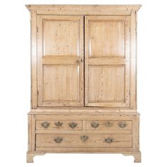 an old wooden armoire with two doors and drawers on one side, against a white background