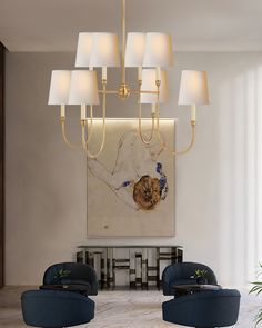 a living room scene with focus on the chandelier and two blue couches