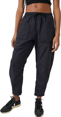 Designed for hiking trips and outdoor adventures, these lightweight pants are featured in a water-resistant fabrication with cargo-inspired pockets and an elastic waistband. Fit & Design: Relaxed fit Mid-rise Straight-leg style Water-resistant fabrication Lightweight, durable design Smocked elastic waistband with adjustable bungee cord detail Zippered back pockets and front pockets at thighs Articulated knees Carrot-inspired leg shape with zipper detail at hems Black Waterproof Utility Cargo Pants, Black Utility Waterproof Cargo Pants, Black Utility Style Waterproof Cargo Pants, Black Waterproof Utility Bottoms, Utility Parachute Pants With Elastic Waistband For Hiking, Black Athleisure Pants For Hiking, Utility Parachute Pants For Hiking With Elastic Waistband, Black Utility Bottoms For Outdoor Work, Relaxed Fit Parachute Pants With Pockets For Outdoor Activities