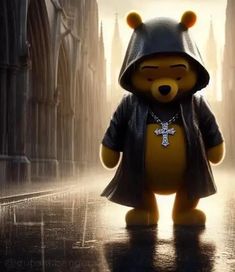 a teddy bear with a hood and cross on it's chest standing in the rain