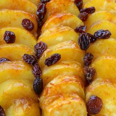 an assortment of baked goods with raisins on them