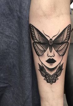 a woman's face with a butterfly tattoo on her leg and the word interest