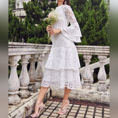 Gorgeous Floral Embroidered Lace Layered Dress White * Long Sheer Lace Sleeve * High Banded Neckline * Tiered Bell Sleeve & Hem * Back Zip * High Waist * Midi Length Skirt *Approximate Unstretched Measurements* Xs 2 *Bust 34" *Waist 26.25" * Hip 36.5" *Sleeve Length 26" *Length 45.25" Small 4 *Bust 35.25" *Waist 28" * Hip 38.25" *Sleeve Length 26.25" *Length 46" Medium 6 *Bust 37" *Waist 29.25" * Hip 39.75" *Sleeve Length 27" * Length 47" Large 8 /10 *Bust 39.25" *Waist 32" * Hip 42" *Sleeve Len Floral Embroidered Midi Lace Dress For Wedding, Lace Dress With Floral Embroidery For Brunch, Lace Embroidered Midi Dress For Wedding, Wedding Lace Embroidered Midi Dress, Elegant Embroidered Lace Dress For Garden Party, Elegant Lace Embroidered Dress For Garden Party, Lace Midi Dress With Floral Embroidery For Brunch, Embroidered Midi Lace Dress For Wedding, Embroidered Lace Midi Dress For Wedding