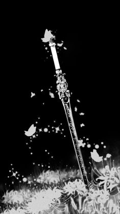 a black and white photo of a baseball bat in the air with butterflies flying around it