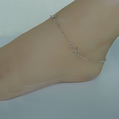 Sterling silver foot anklet with starfish charms. Length: 10.5 inches. Starfish: 10 x 16 mm Price listed is for ONE piece. These anklets are made of 925 hypoallergenic sterling silver. Can be packaged in a gift box. I can include a personal message from you if needed You are welcome to contact me at... bhavnakwintra1956@gmail.com For more beautiful pieces from my shop, please browse 👇 TOE RINGS: https://www.etsy.com/your/shops/TheSilverGame/tools/listings/section:27020628,view:table EAR HOOPS: Dainty Silver Anklet With Adjustable Chain, Silver Minimalist Metal Anklets, Minimalist Silver Metal Anklets, Silver Anklet With Delicate Chain As Gift, Silver Delicate Chain Anklet For Gift, Silver Delicate Chain Anklet As Gift, Delicate Silver Anklet As A Gift, Starfish Anklets, Anklet Chain