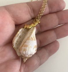 "Hand painted seashell  Gold painted accents. Mermaid charm pendant. 24\" Chain Shell is 1.5\" long. Shells have imperfections not a smooth surface.  They have been tumbled by the waves. Gift box is included. Custom orders welcomed. Free shipping within the USA USA Seller" Ocean-inspired Shell Necklace With Lobster Clasp For Gift, Pendant Shell Necklace With Lobster Clasp As Gift, White Pendant Shell Necklace With Lobster Clasp, Shell-shaped Charm Necklaces Made Of Shell As Gift, Ocean-inspired Shell Pendant Necklace With Lobster Clasp, Shell Charm Necklace As A Gift, White Shell Charm Necklace As Gift, Shell Pendant Charm Necklaces For Gifts, White Shell Charm Necklace For Gift