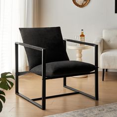 a black chair sitting on top of a hard wood floor