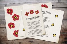 three papers with red and yellow flowers on them