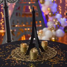 the eiffel tower is decorated with candles