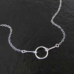 For this necklace I used a dainty sterling silver 10mm circle. I attached sterling silver bars to the circle with small rings. To the bars I connected the chain. The overall length of the necklace from end to end is 15 3/4", but you can choose other lengths in the option bar, even bracelet lengths. The chain has a spring clasp, and a Theresa Mink signature tag attached. This necklace is similar to the necklace made by Dogeared. Karma Necklace, Silver Bars, Small Rings, Infinity Bracelet, Gold Filled, Choker Necklace, Silver Bracelet, Silver Necklace, Chain