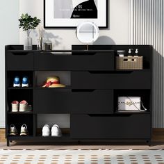 a black shelf with shoes on it in a room