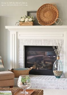 a living room with a fire place and wicker baskets on the mantels