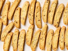 cookies are lined up on a white surface