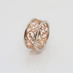 Sterling Silver Two Tone Rose Gold Plated Filigree Band Ring ....Marked 925...Total of weights 3.6grams...Size 9...Measure of Band 8.7MM...It's in very good condition. Rose Gold Rings Stamped 925 For Anniversary, Rose Gold 925 Stamped Rings For Anniversary, Rose Gold Stamped 925 Rings For Anniversary, Rose Gold Accents, Filigree Design, Metal Rings, Sterling Silber, Band Ring, Vintage Sterling Silver