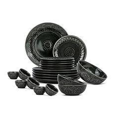 black and white dinnerware set with ornate designs on the plates, cups and bowls