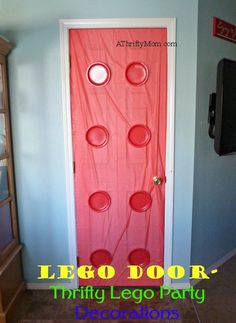 a door with red circles on it and the words lego door - trinty leg party decorations