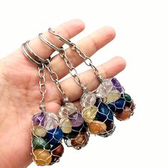 This listing is for ONE (1) Seven Stone Chakra Keychain with a Silver or Gold Tone Chain and Keyring (6BROWNSHELF-58)(6BROWNSHELF-59) Makes great gifts for your friends Measures approx.: 32mm x 23mm *not including keychain or keyring* AVAILABLE IN: - Silver Toned - Gold Tone **PLEASE USE THE DROP DOWN MENU TO CHOOSE YOUR RING TONE.** Please refer to the photo with the keychain in hand for better sizing reference. Available in many stone choices here https://www.etsy.com/shop/RockParadise?ref=hdr Stone Keychain, Beads Keychain, Spiritual Living, Chakra Beads, Worry Stones, Beaded Keychains, Chakra Stones, Tumbled Stones, Tumbling