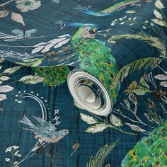 a blue and green wallpaper with peacocks on it's back drop cloth