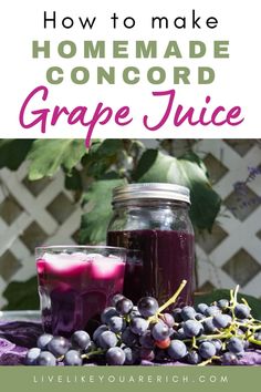 homemade concord grape juice in mason jars with grapes on the side