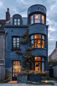 a blue brick building with lots of windows