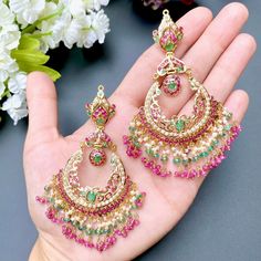 Featuring a bridal jadau necklace set in 22ct gold paired with a pair of chandbali earrings. It has been embellished with pearls, rubies and emeralds. The necklace weighs 66.96 GMS including 10.09 GMs of hanging ruby emerald beads. The earrings weigh 37.73 GMs including 6.65 GMs of hanging ruby emerald beads. Price Breakup Summary Component Rupees % of Total 22k Gold 422,837 75.0% Stones & Beads 48,250 8.6% Making Charges 76,111 13.5% Taxes (GST) 16,416 3.0% Total 563,613 100.0% View Detailed Pr 22k Gold Jewelry Necklaces, 22k Gold Necklace, 22k Gold Jewelry, Chandbali Earrings, Pearl Necklace Set, Emerald Bead, Gold Jewelry Necklace, Gold Necklace Set, Emerald Necklace