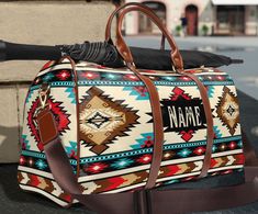 This personalized southwestern Ombre style tribal Indian travel bag is all about style. Our leather western boho duffel bag is made with high-grade waterproof fabric, it's a highly durable means of transferring your essentials wherever you go. With multiple compartments, a resilient carrying handle, and an adjustable shoulder strap, it's the perfect companion for all your adventures. This southwestern aztec tribal Indian design will have everyone asking where you got it, great Christmas or birth Western Style Rectangular Travel Bag, Bohemian Duffle Bag For Overnight Trips, Western Style Satchel Bag For Travel, Bohemian Rectangular Duffle Bag For Overnight Trips, Bohemian Duffle Bag With Large Capacity For Trips, Bohemian Large Capacity Duffle Bag For Weekend Trips, Indian Travel, Western Stuff, Cowgirl Accessories