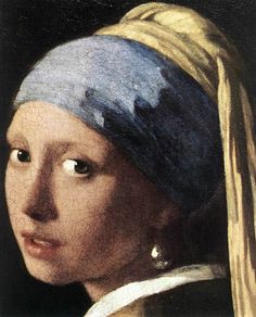 a painting of a woman with a pearl ear wearing a blue and white headdress