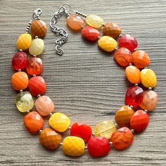 💞One of a kind & ready to ship💞  Shades of Fall! A mix of Earthy neutrals create a chunky statement look for your favorite season. All acrylic beads make this extremely lightweight 😍  About 16 inches long with a 4 inch extender chain. Silver chain and lobster clasp.  *Smoke and pet free home!* I ship 6 days a week.   Thank you for browsing my store! Orange Jewelry With Large Oval Beads, Handmade Orange Multi-strand Necklace, Elegant Multi-strand Amber Necklace, Adjustable Orange Multi-strand Necklaces, Earthy Neutrals, Orange Multi-strand Polished Beaded Necklace, Fall Cardigan, Autumn Necklace, Jaune Orange