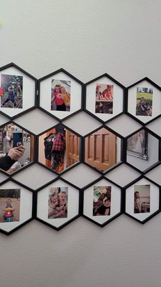 a hexagonal mirror with multiple pictures hanging on it