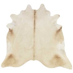 a white cowhide rug is shown on a white background and it looks like an animal's skin