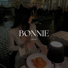 a woman sitting at a table with a plate of food in front of her and the words bonnie on it