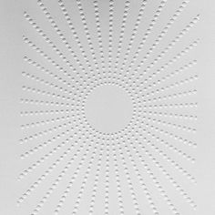 an abstract white background with circles and dots in the shape of a sunburst