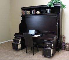 a black desk and chair in a room