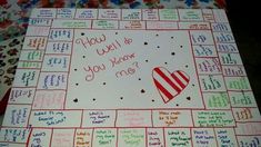 a close up of a board game with words on it and hearts drawn on the board