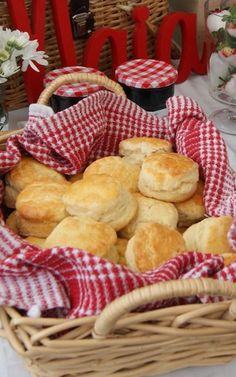 a basket full of biscuits sitting on top of a table