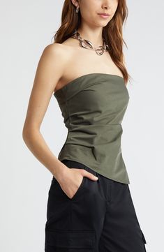 Move from day to date night in this stretchy strapless top designed with soft gathers and an asymmetric hem. 17 1/2" center front length (size Medium) Strapless 65% recycled polyester, 35% polyester Machine wash, tumble dry Imported Fitted Strapless Top, Versatile Fitted Strapless Top, Chic Green Strapless Top, Chic Strapless Ruched Top, Green Strapless Tops For Night Out, Closet Aesthetic, Asymmetric Top, Date Night In, Green City