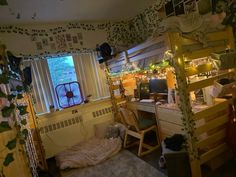 a bedroom with bunk beds and desks in it