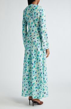 A bias cut accentuates the slubbed linen texture of fabric printed with a blurred floral on this slim dress that can be cinched with a braided waist tie. Hidden shoulder-zip closure Jewel neck Long sleeves Removable waist tie 100% linen Dry clean Imported Designer Clothing Elegant Floral Linen Dress, Fitted Linen Dress With Floral Print, Blue Linen Dress With Floral Print, Elegant Linen Dress With Floral Print, Fitted Floral Print Linen Dress For Garden Party, Fitted Linen Dress With Floral Print For Garden Party, Fitted Linen Floral Dress For Garden Party, Floral Print Linen Maxi Dress, Elegant Linen Maxi Dress With Floral Print