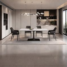 a dining room table and chairs in front of large windows