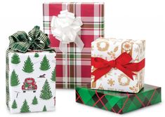 three wrapped presents with bows and plaid wrapping paper