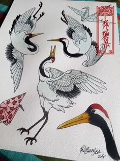 three cranes are depicted on a piece of paper