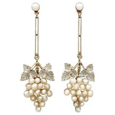 An impressive pair of antique Victorian seed pearl and 15k yellow gold, 9k yellow gold and platinum set drop earrings; part of our diverse antique jewellery collections These fine and impressive antique pearl earrings have been crafted in 15k and 9k yellow gold with platinum settings. Each drop earring has a bunched grape design, the grapes represented by a total of thirty-six natural seed pearls. Each bunch is ornamented to the upper border with a platinum set paired leaf design, and suspends f Luxury Victorian Style Clip-on Earrings, Antique Gold Set, Victorian Earrings Antiques, Victorian Drop Earrings, Art Deco Drop Earrings, Cluster Jewelry, Grape Design, Grape Earrings, Natural Pearl Earrings