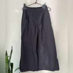 This Is New With The Sample Tag Still Attached. Color: Washed Black Wide Leg Ankle Pants In Lightweight Cotton. Has Front Pockets. Size 2 26” Inseam 11” Rise 15” Leg Opening 12 1/2” Across The Waistband Chic Black Cropped Wide Leg Pants, Black Summer Ankle-length Culottes, Workwear Ankle-length Capris With Side Pockets, Workwear Capris With Side Pockets, Ankle-length Capris With Side Pockets For Work, Solid Culottes With Pockets Ankle-length, Black Cropped Leg Bottoms For Work, Black Cropped Bottoms For Workwear, Black Relaxed Fit Wide Leg Pants For Day Out