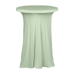 a small round table with a light green cover on the top and bottom, sitting in front of a white background