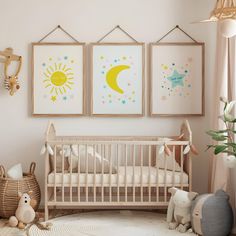 a baby's room with three pictures on the wall