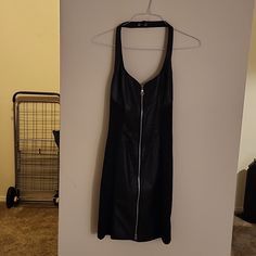 Black Leather Down The Middle Of The Dress And Spandex On The Sides. Zipper Down The Back And Snap Around The Neck. Size L. No Refunds. Black Stretch Bodycon Dress With Side Zipper, Fitted Black Bodycon Dress With Zipper Closure, Black Bodycon Dress With Side Zipper For Night Out, Black Evening Dress With Zipper Closure, Black Stretch Mini Dress With Side Zipper, Black Edgy Mini Dress With Back Zipper, Black Knee-length Bodycon Dress With Side Zipper, Black Sleeveless Dress With Zipper Closure, Black Bodycon Dress With Zipper Closure