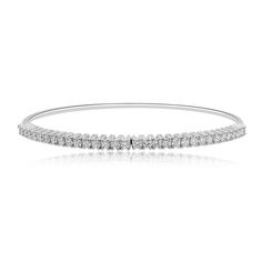 18ct white gold diamond bangle.
Oval shaped bangle, with round brilliant diamonds, set in a classic claw setting.
Concealed fastening. 
The diamonds total 0.82ct and are G colour, SI1 clarity. 
Presented in our branded boxes.
Free next day Special Delivery on all online purchases where possible. Claw Setting, Diamond Bangle, Special Delivery, Ring Size Guide, Brilliant Diamond, Gold Platinum, Three Stone, Brilliant Cut Diamond, White Gold Diamonds