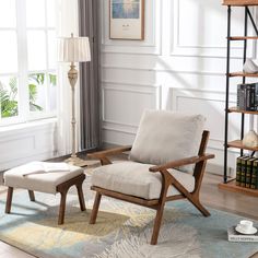 a living room with a chair and ottoman