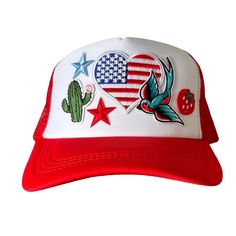 a red and white trucker hat with an american flag design on the front side