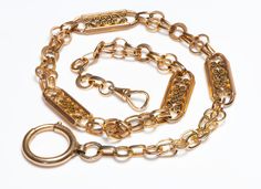 Antique Gold Watch Chain Necklace.Impressive antique watch chain with large pierced panels and a an exceptionally large spring ring clasp. Weight 40.8 Grams. Length 17 inches. Luxury Antique Box Chain Jewelry, Luxury Antique Link Chain Necklace, Antique Watch, Genuine Love, Antique Watches, Watch Chain, Yellow Gold Chain, Spring Rings, Gold Watch